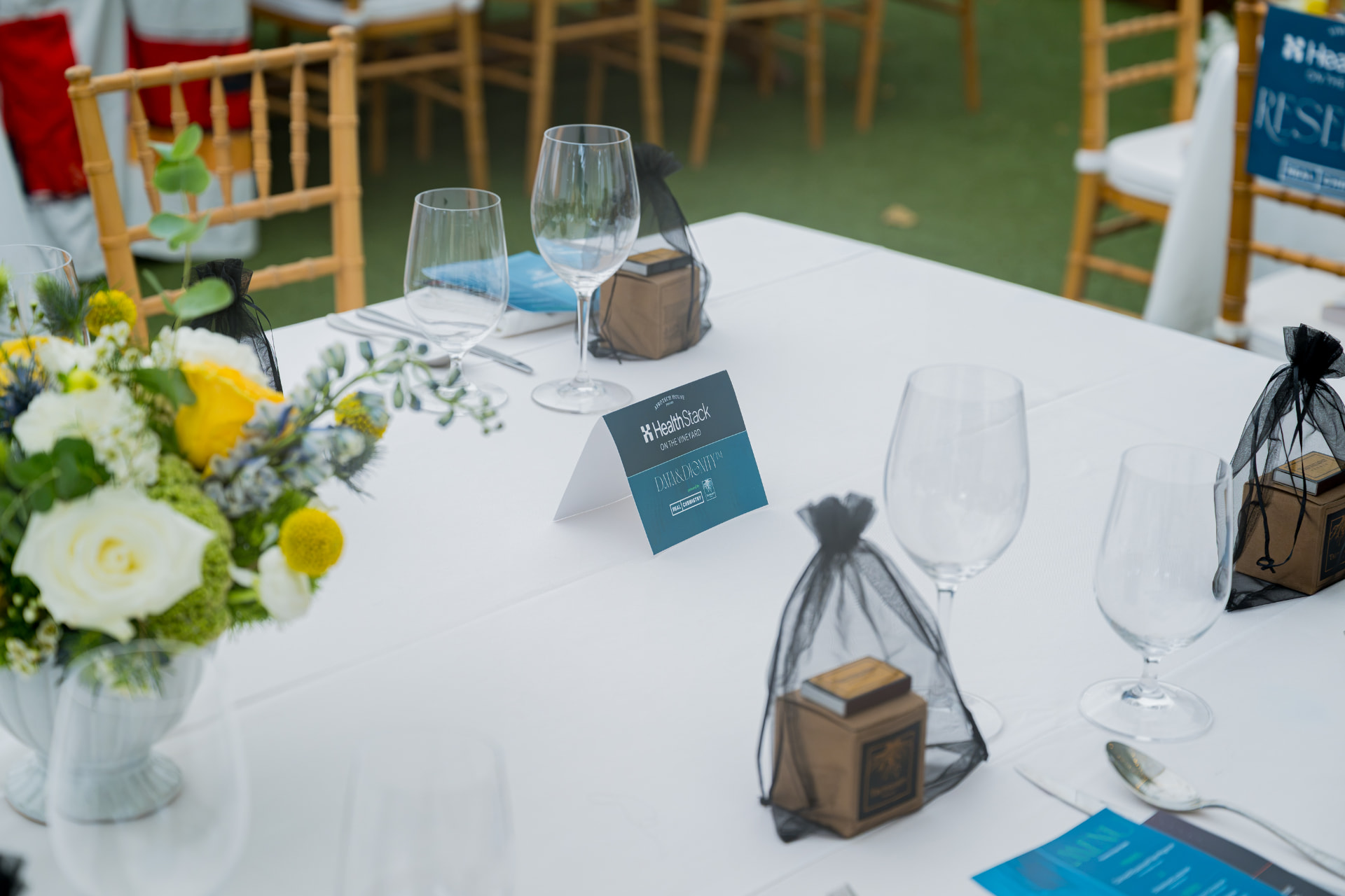 Dinner table with Data + Dignity table card at Afrotech HealthStack